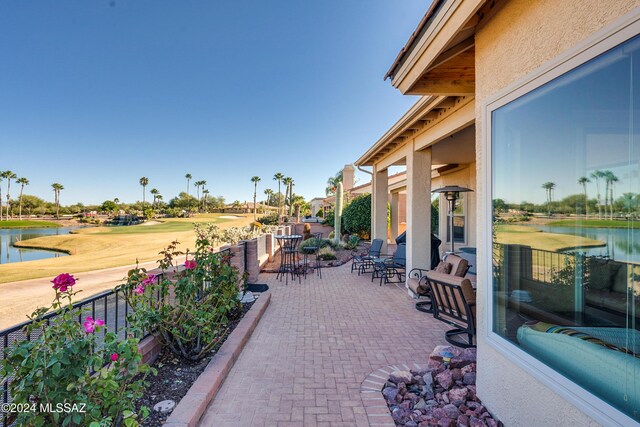 view of patio / terrace with a water view