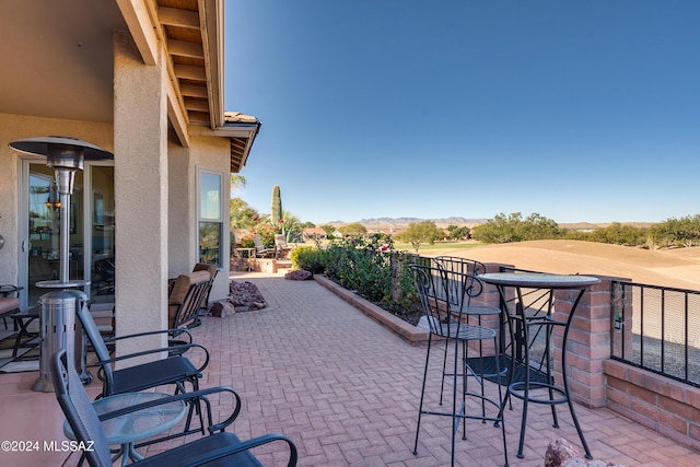 view of patio / terrace featuring a mountain view