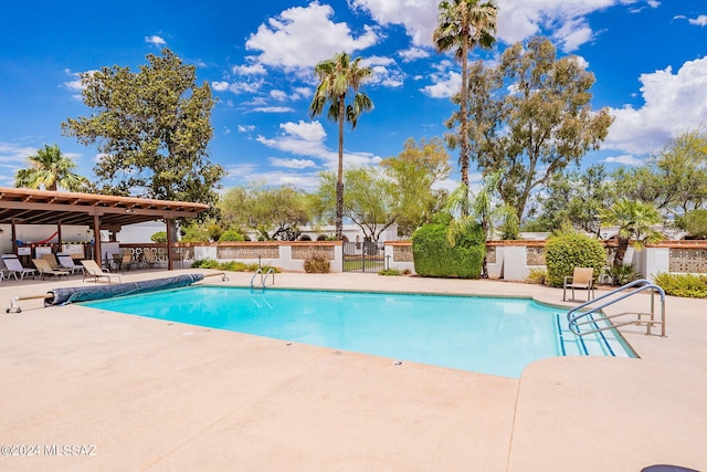 view of swimming pool with a patio area