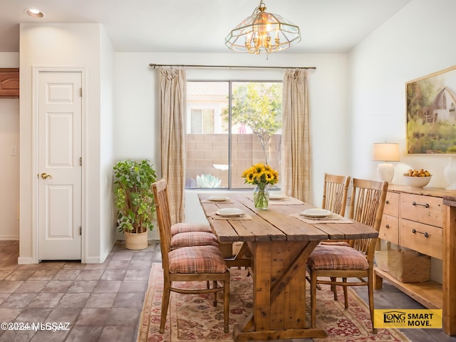 5567 W Dove Loft Dr, Marana, AZ 85658 - dining area featuring a chandelier, baseboards, and recessed lighting