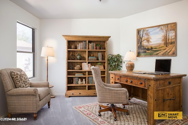 5567 W Dove Loft Dr, Marana, AZ 85658 - office area with wood finished floors and baseboards