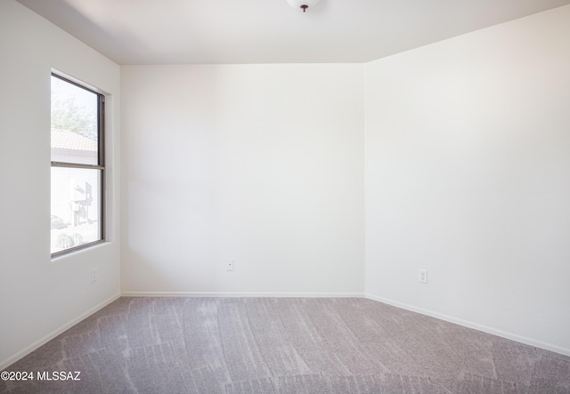 5567 W Dove Loft Dr, Marana, AZ 85658 - empty room featuring carpet and baseboards