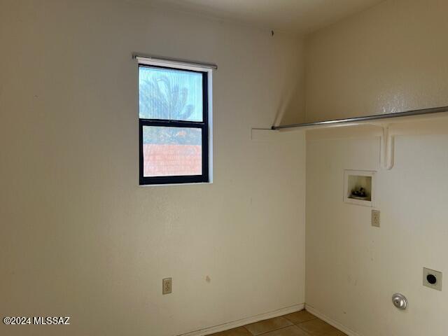 washroom featuring washer hookup, hookup for an electric dryer, and light tile patterned floors