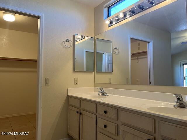 bathroom with vanity and tile patterned flooring