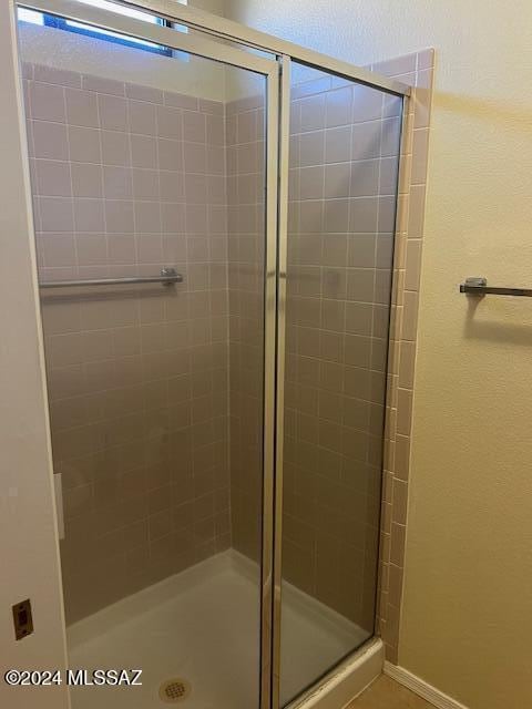 bathroom featuring an enclosed shower