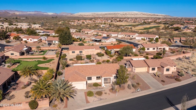 birds eye view of property featuring a mountain view