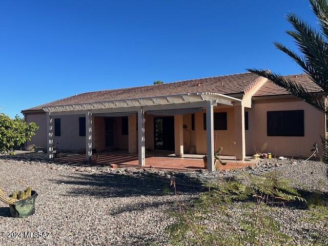 rear view of house with a patio