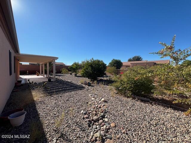 view of yard with a patio area and a pergola