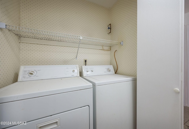 laundry area with independent washer and dryer