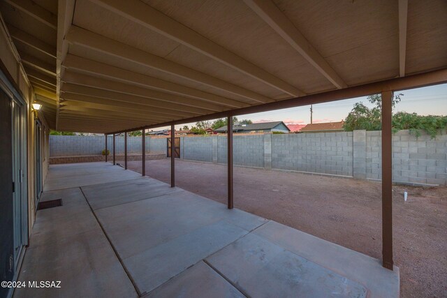 view of patio terrace at dusk