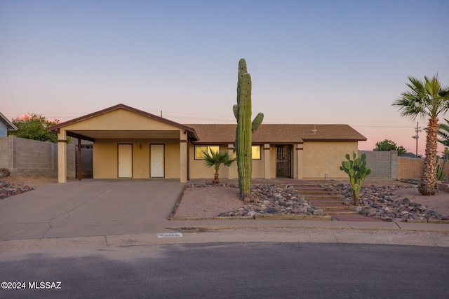 view of front of property with a carport