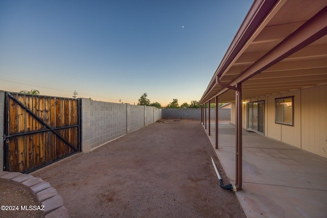 view of patio terrace at dusk