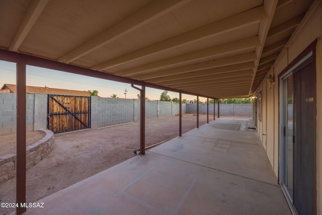 view of patio terrace at dusk