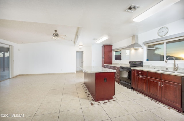 kitchen with sink, light stone counters, a center island, wall chimney range hood, and black / electric stove