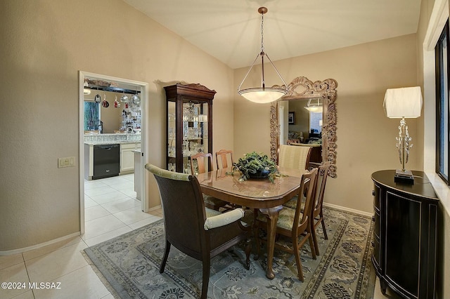 4115 S Constancia Ct, Green Valley, AZ 85622 - dining room featuring lofted ceiling, light tile patterned floors, and baseboards