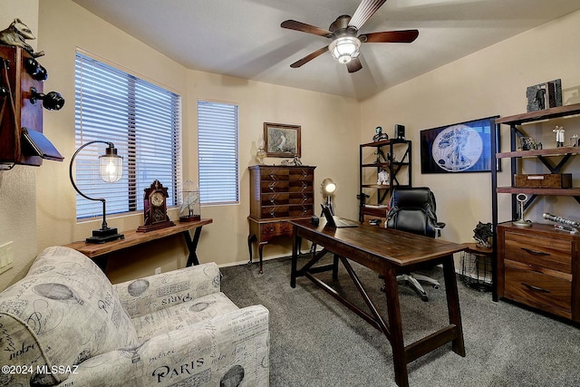 carpeted home office with ceiling fan