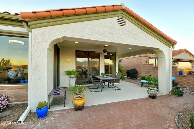 view of patio / terrace featuring ceiling fan and a grill