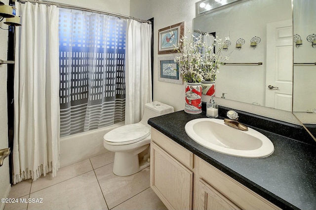 full bathroom featuring tile patterned floors, shower / bath combo, toilet, and vanity