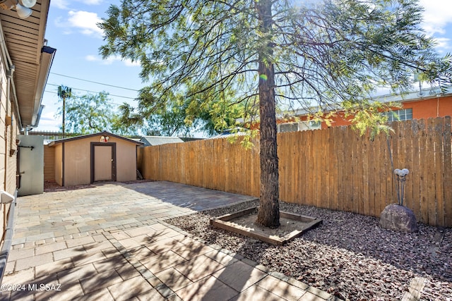 view of patio featuring a shed