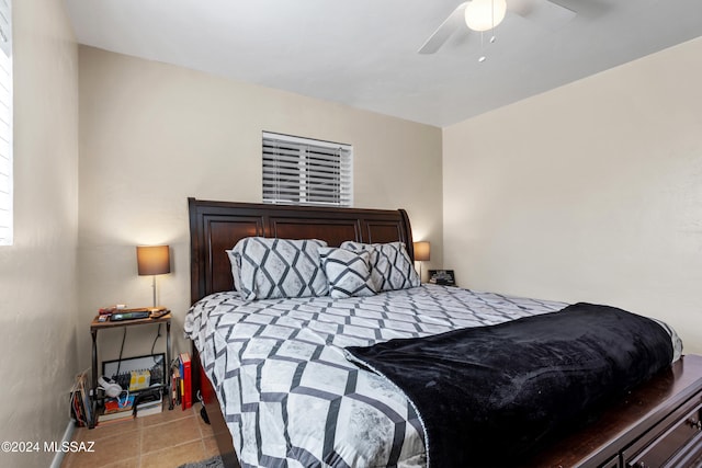 bedroom featuring ceiling fan and light tile patterned floors