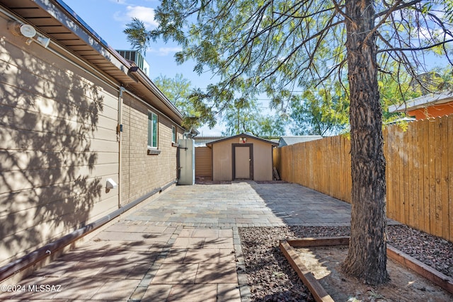 view of patio with a shed