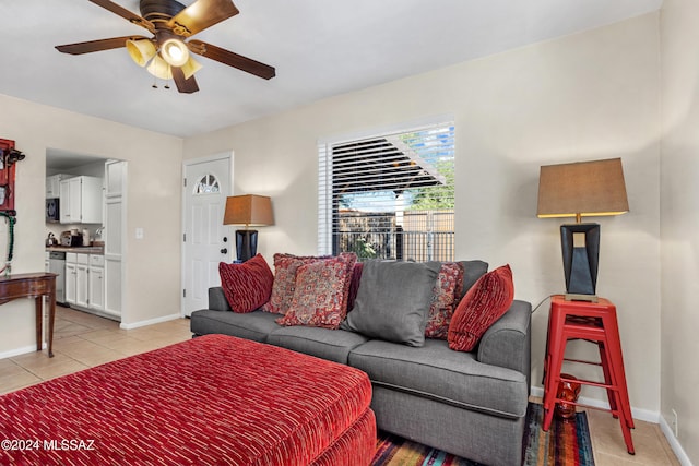 living room with ceiling fan and light tile patterned floors