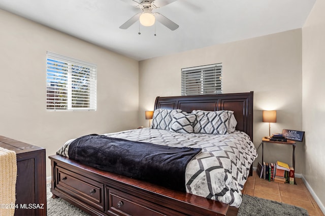 bedroom featuring ceiling fan and light tile patterned floors