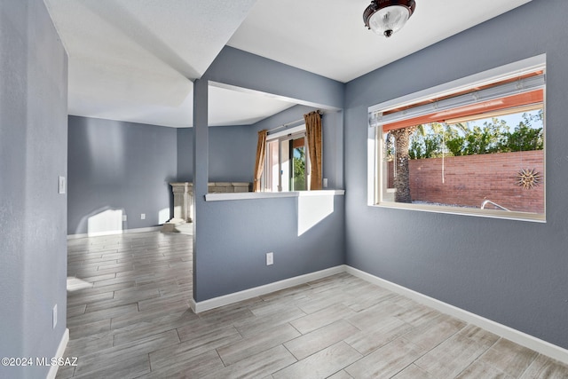 unfurnished room featuring light wood-type flooring