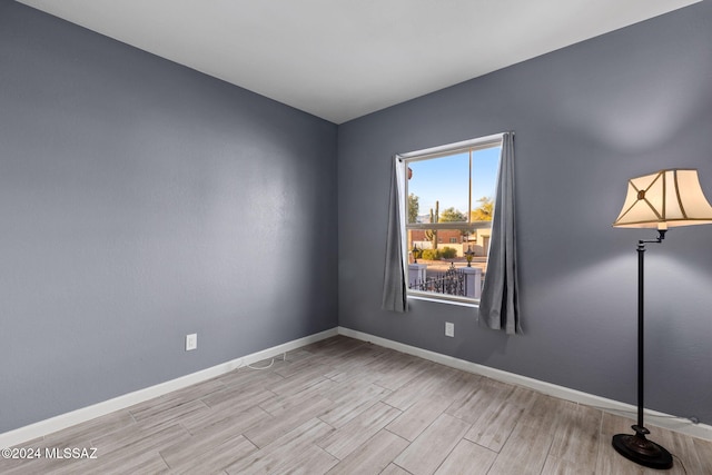 spare room featuring light hardwood / wood-style flooring