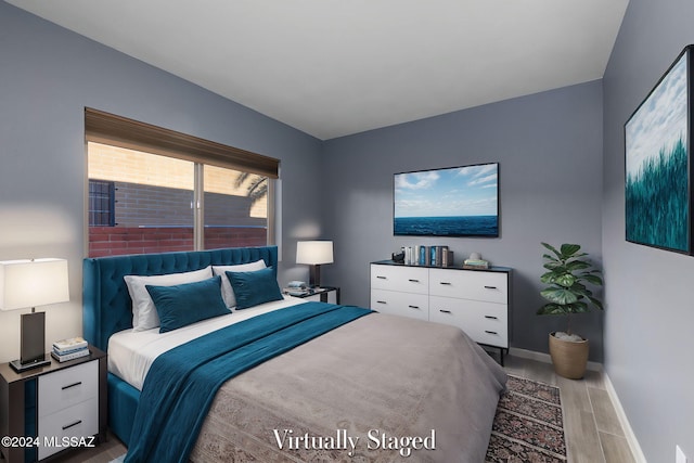 bedroom with light wood-type flooring