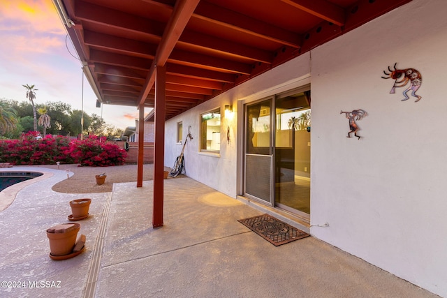 view of patio terrace at dusk