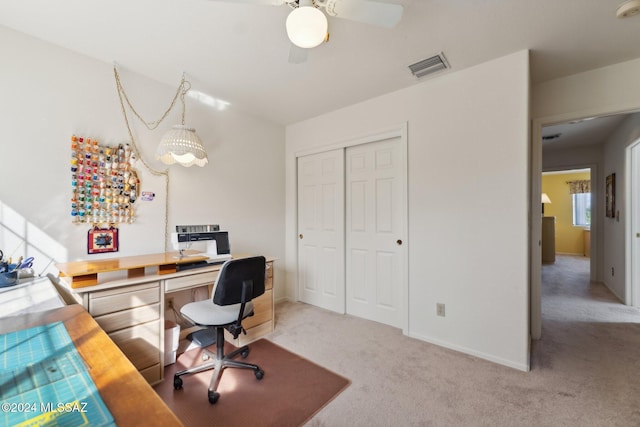 office area with light carpet, baseboards, and visible vents