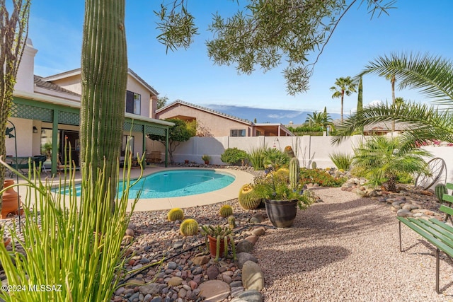 view of pool with a fenced in pool, a fenced backyard, and a patio