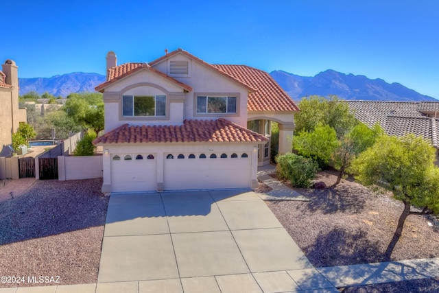 view of front of home featuring a mountain view and a garage