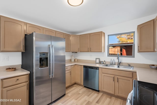 kitchen featuring stainless steel appliances, sink, and light brown cabinets