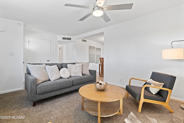 living room featuring carpet floors and ceiling fan