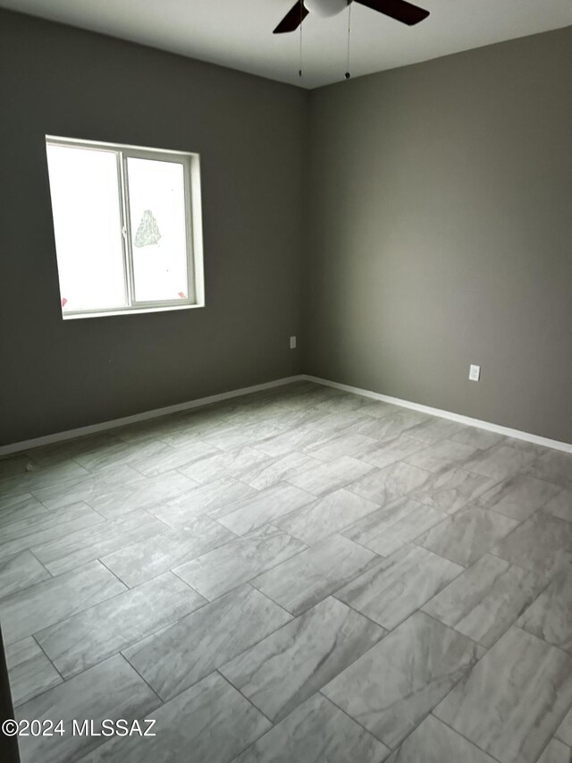 unfurnished room featuring ceiling fan