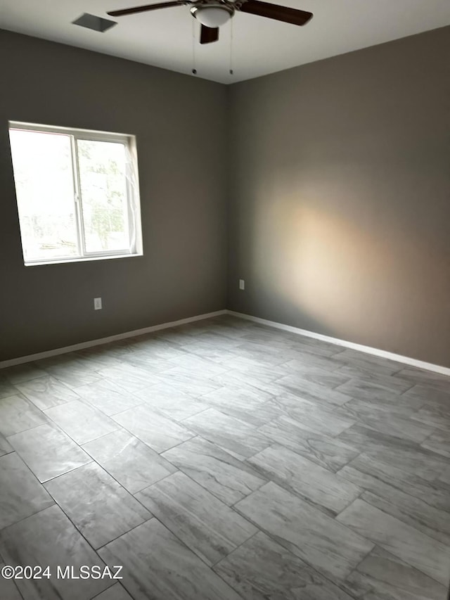 empty room featuring ceiling fan