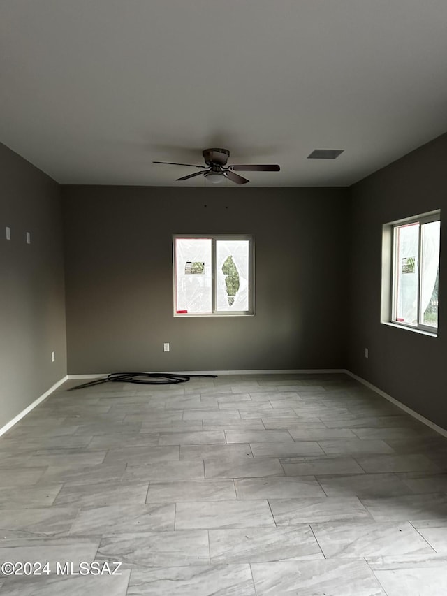 spare room with ceiling fan