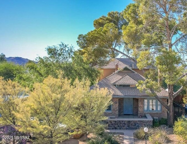 view of front of property with a mountain view