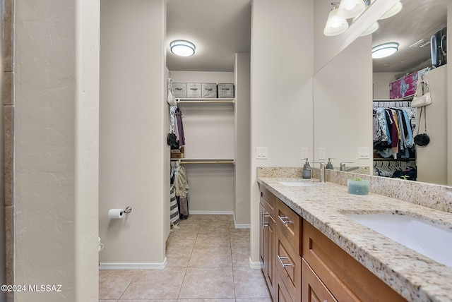 bathroom featuring tile patterned flooring and vanity