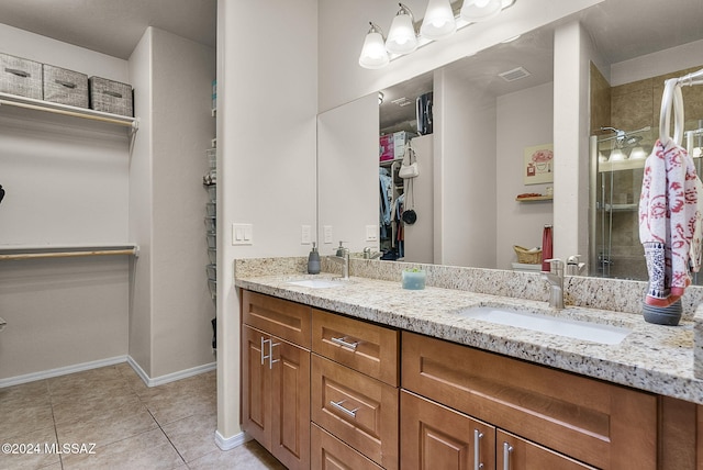 bathroom featuring vanity and tile patterned flooring