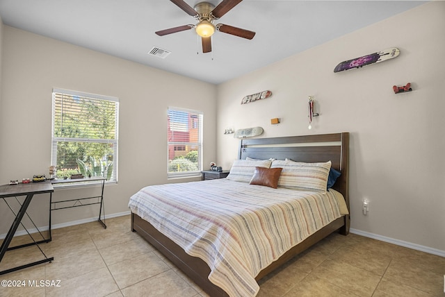 tiled bedroom with ceiling fan