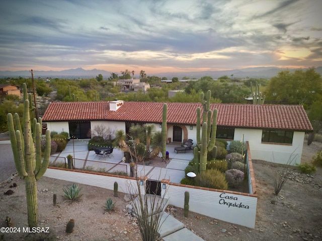 view of front of home with a patio area