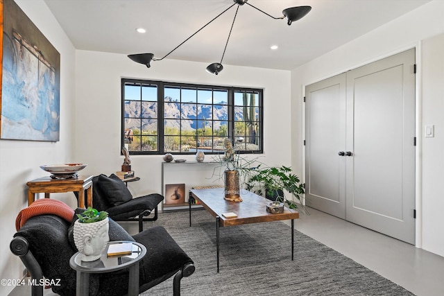 living area with concrete flooring