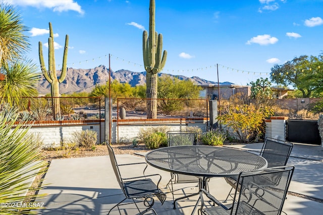 view of patio / terrace with a mountain view