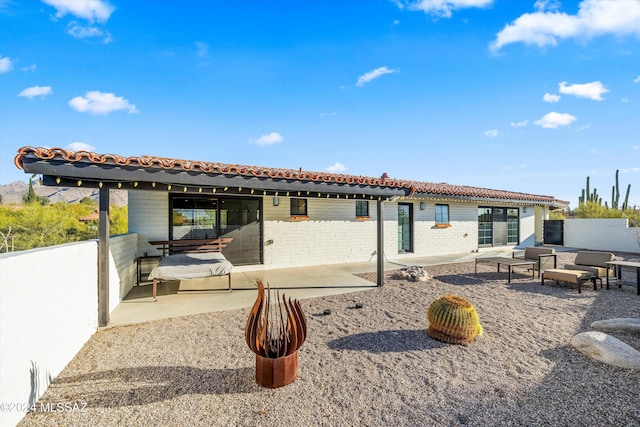 rear view of house featuring a patio