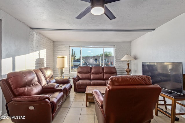 tiled living room featuring ceiling fan