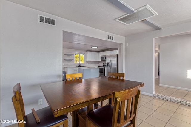 tiled dining area with sink