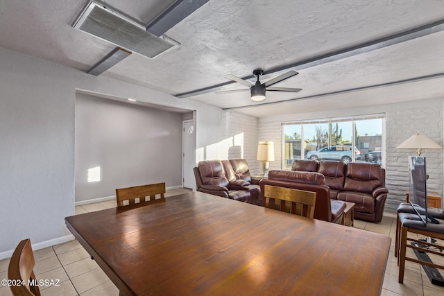 dining area featuring ceiling fan and light tile patterned flooring